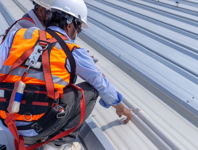 Two Workers Inspecting Rooftop(sm)