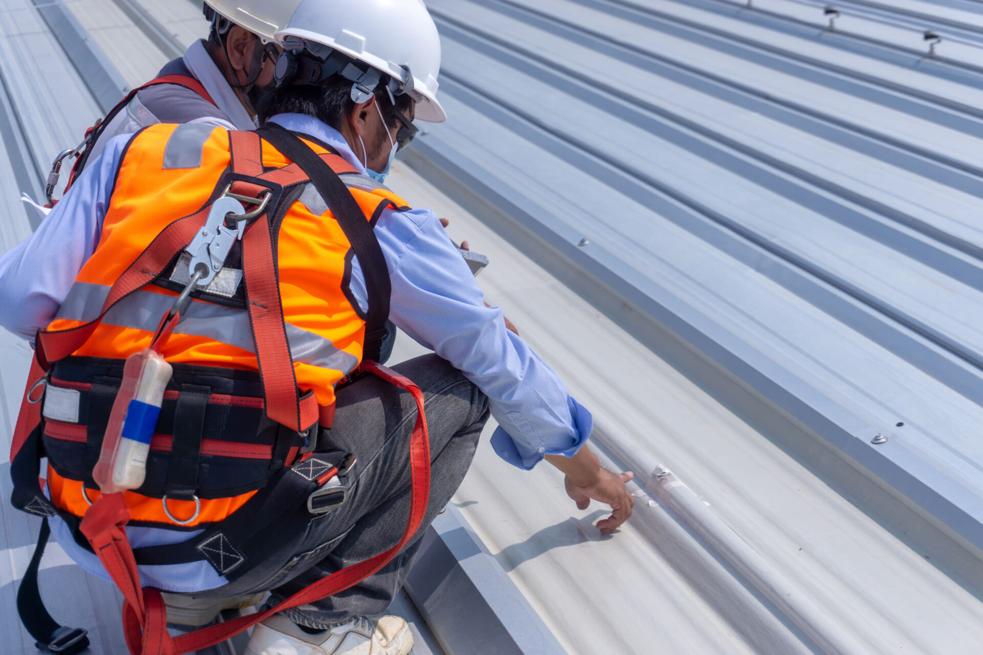 Two Workers Inspecting Rooftop